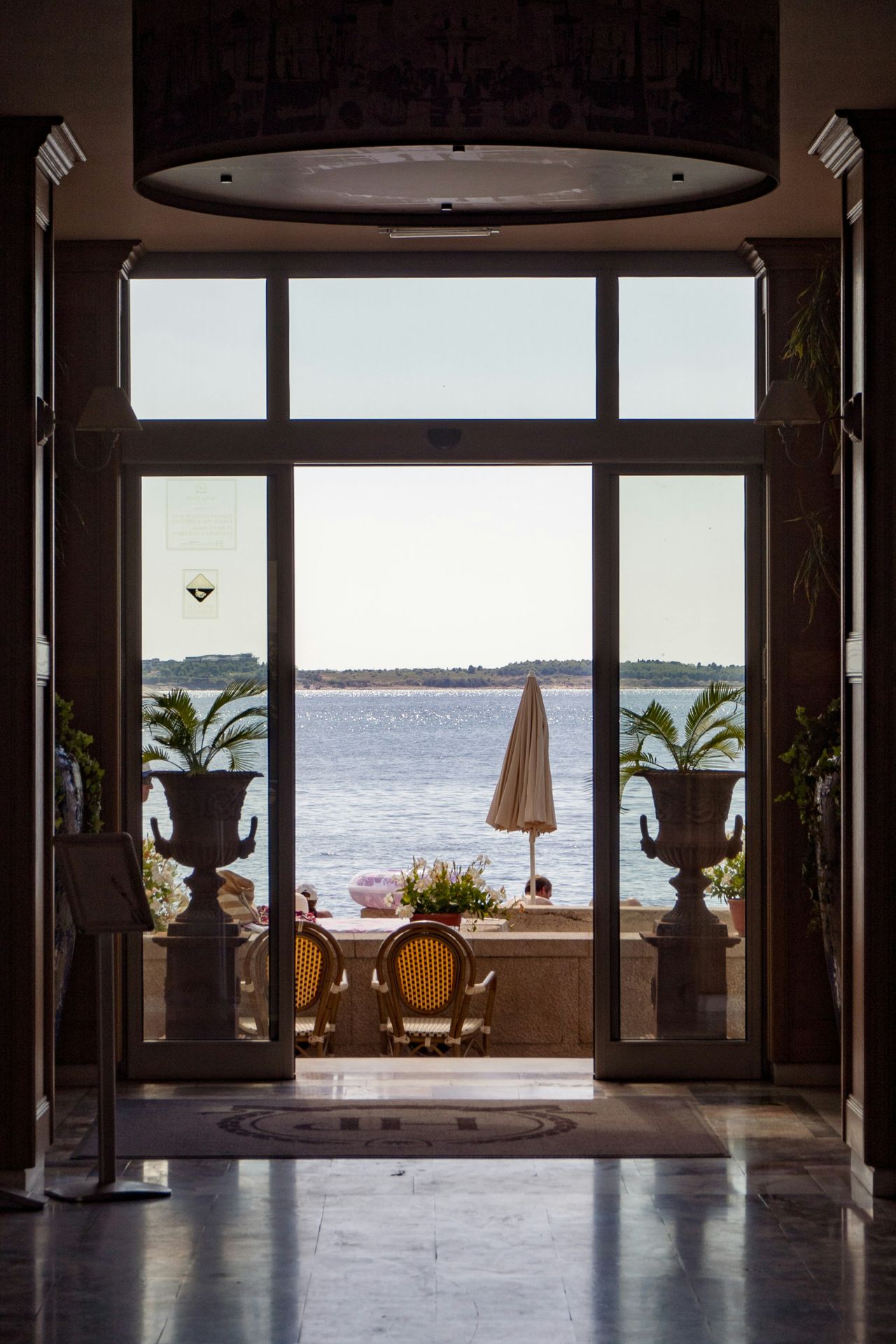 Glass doors opening onto a sea view