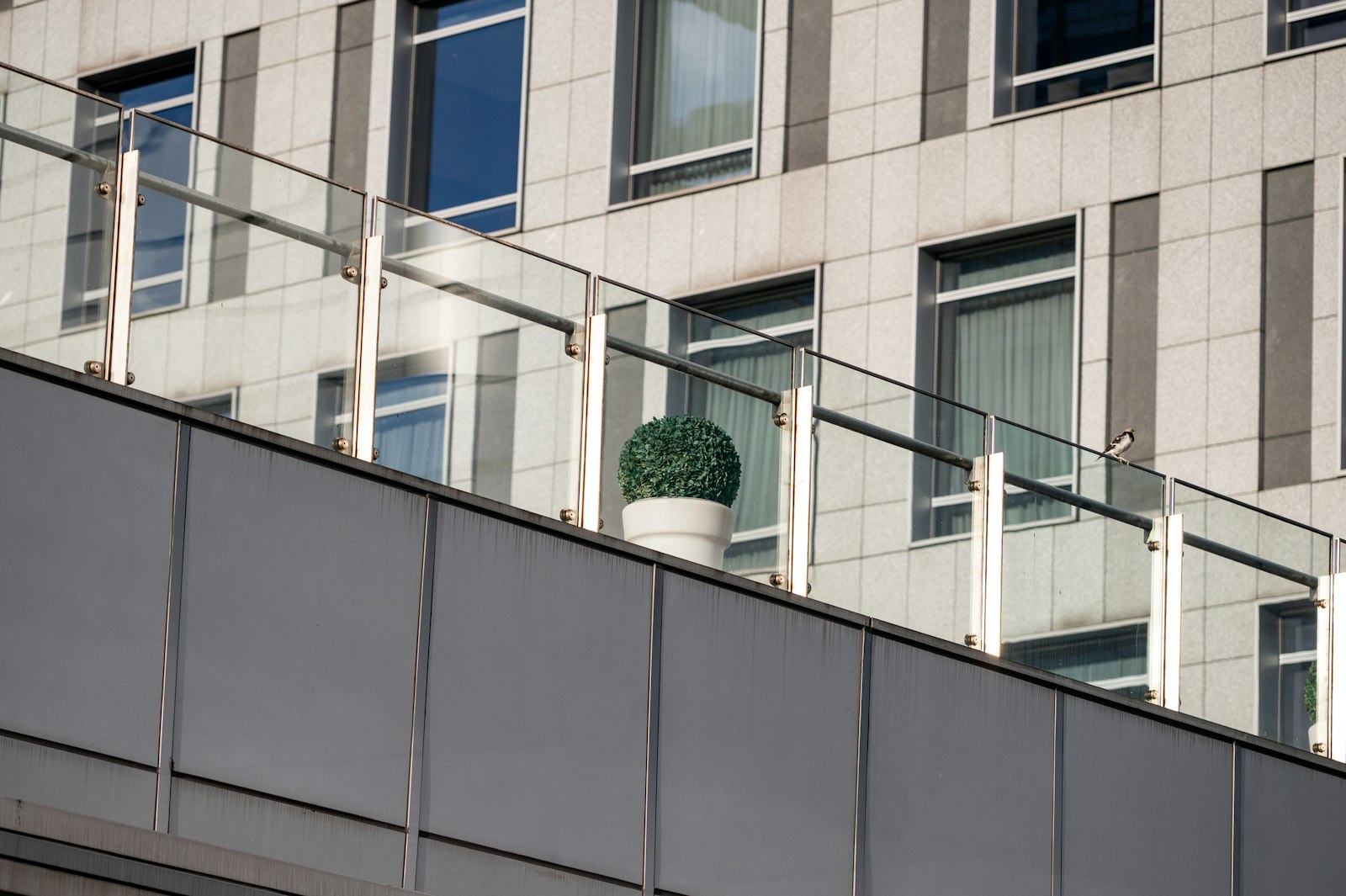 Glass balcony railing on a modern building